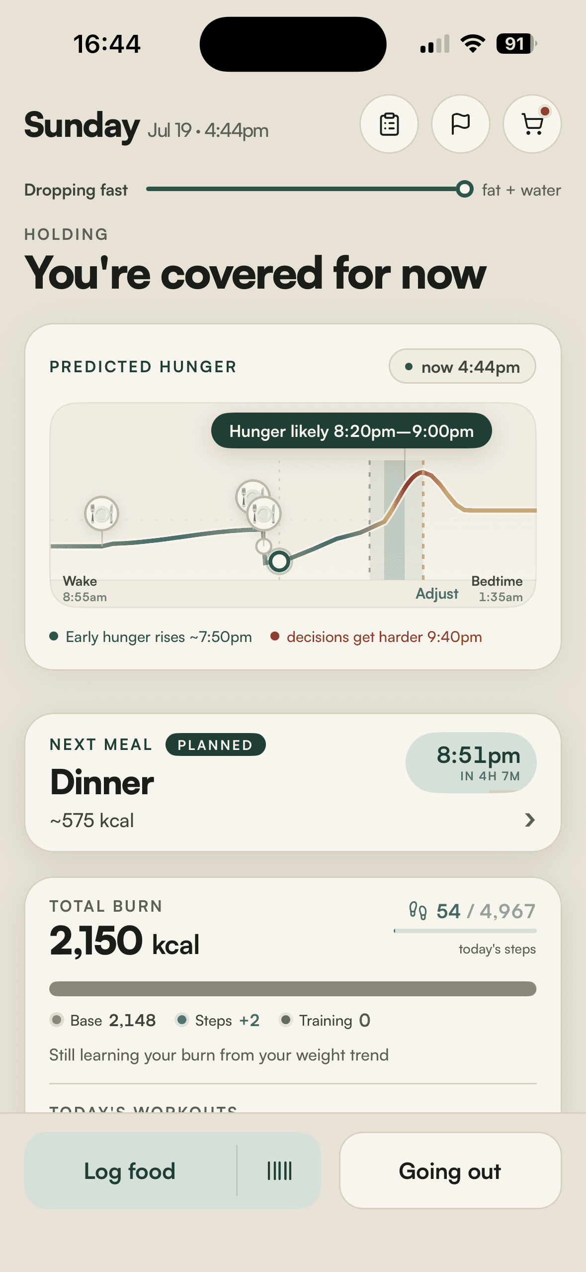 The Knoomi app: a predicted-hunger graph for the day, with the next meal, training readiness, and the day's burn.